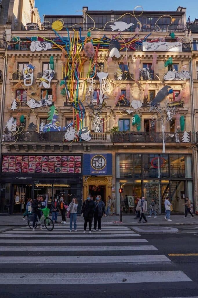 The colorful and eclectic facade of 59 Rivoli, an artist squat-turned-gallery featuring bold street art, sculptures, and paintings, making it one of the most creative hidden gems in Paris for contemporary art lovers.