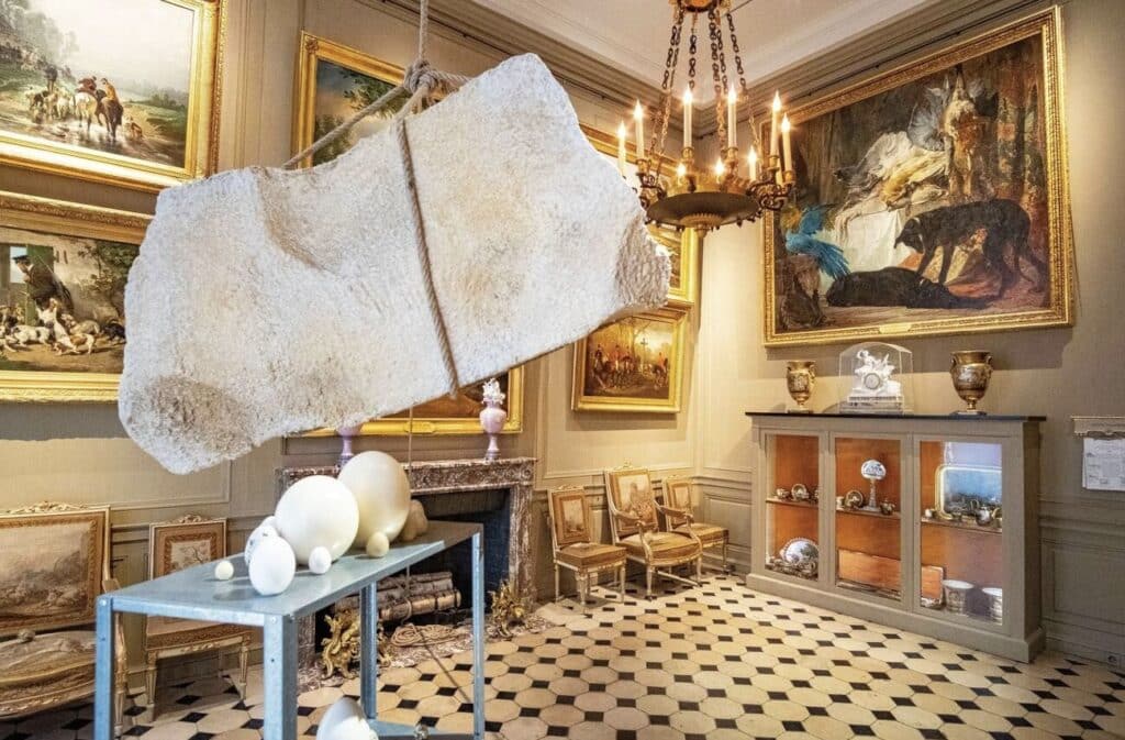 Eclectic room inside the Musée de la Chasse et de la Nature in Paris, featuring classical paintings, taxidermy, and contemporary art installations, one of the hidden gems in Paris for art and nature lovers.