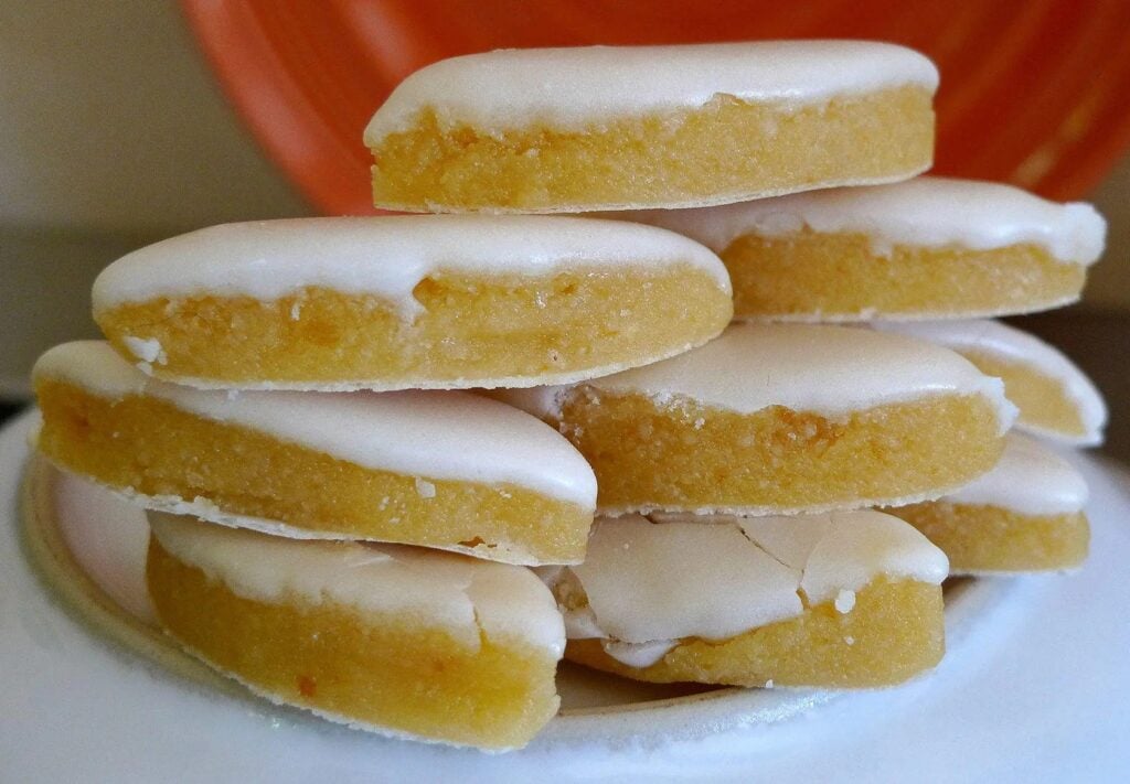 Stack of Calisson d'Aix, traditional French confectionery from Aix-en-Provence, with a smooth, pale icing over a layer of candied fruit paste, a sweet treat and popular souvenir from Marseille.