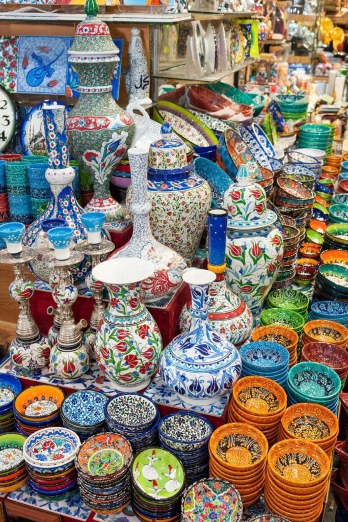 A vibrant display of colorful, hand-painted ceramics and pottery, often seen as popular Marseille souvenirs.