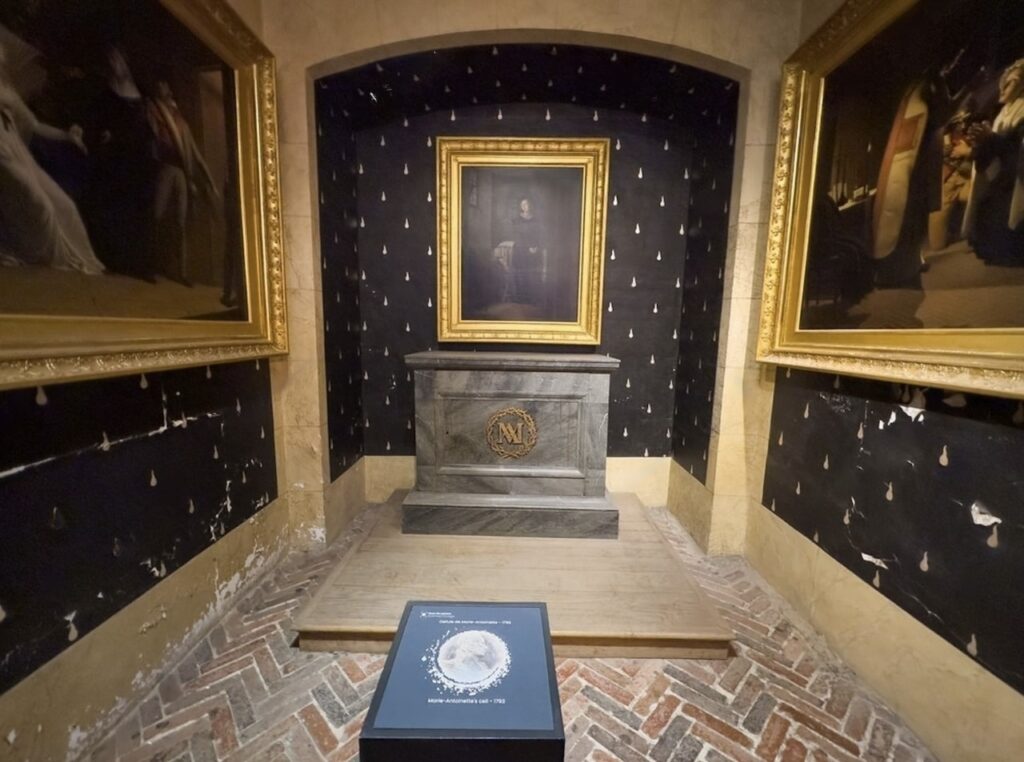 Recreation of Marie Antoinette’s prison cell inside the Conciergerie, one of the hidden gems in Paris where visitors can see the somber space where the queen was held before her execution during the French Revolution.