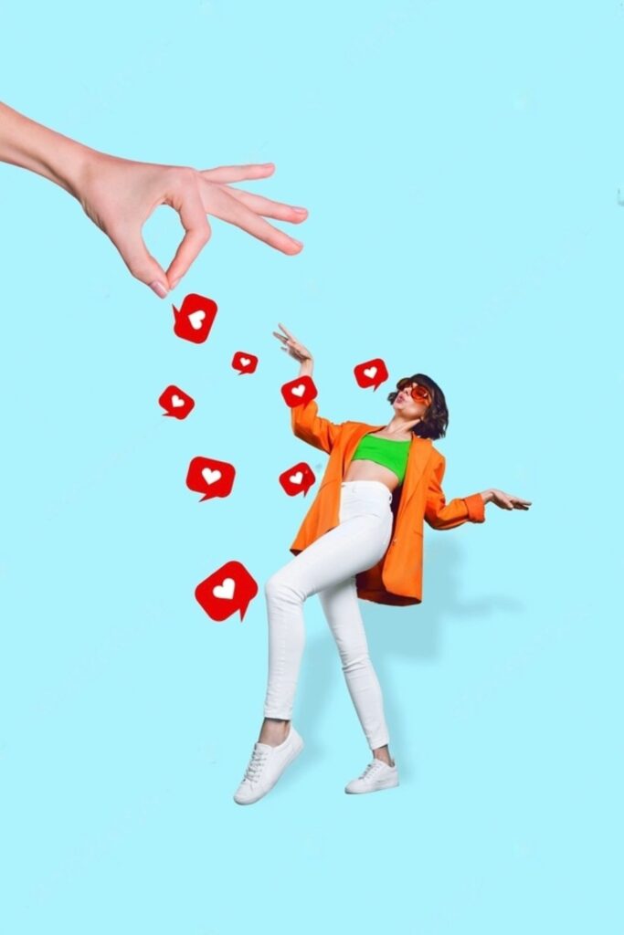 A stylish woman in white sunglasses, a bright orange blazer, and white jeans playfully dances to catch red heart-shaped social media likes, falling from a giant hand against a sky-blue background—ideal for pairing with lively Paris-themed Instagram quotes.