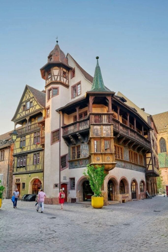 The iconic Pfister House in Colmar, France, a 16th-century architectural gem with a distinctive turret, wooden balconies, and Renaissance-style frescoes. Its beautifully preserved façade stands out in the heart of the Old Town. A must-visit landmark when spending one day in Colmar to admire the city’s rich history.
