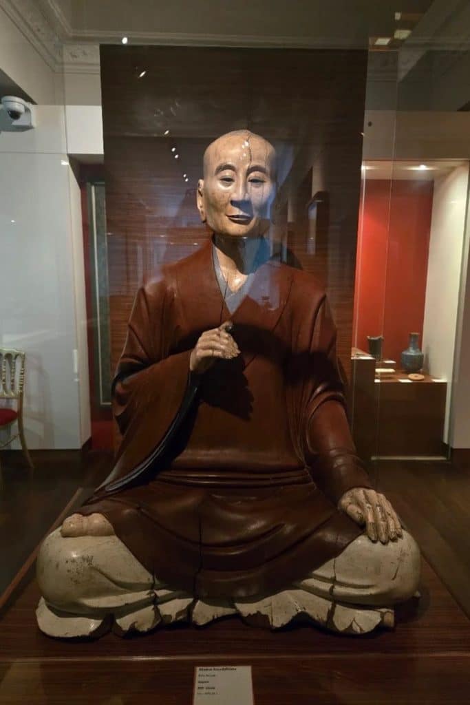 Japanese Buddhist monk statue displayed at the Musée des Arts Asiatiques in Toulon