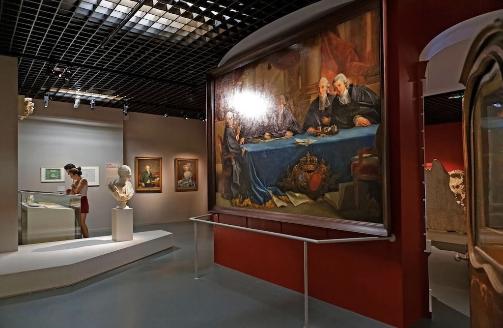 A visitor explores the Musée d'Aquitaine, home to historic paintings, sculptures, and artifacts that showcase Bordeaux’s rich past—one of the most fascinating things to do in Bordeaux.