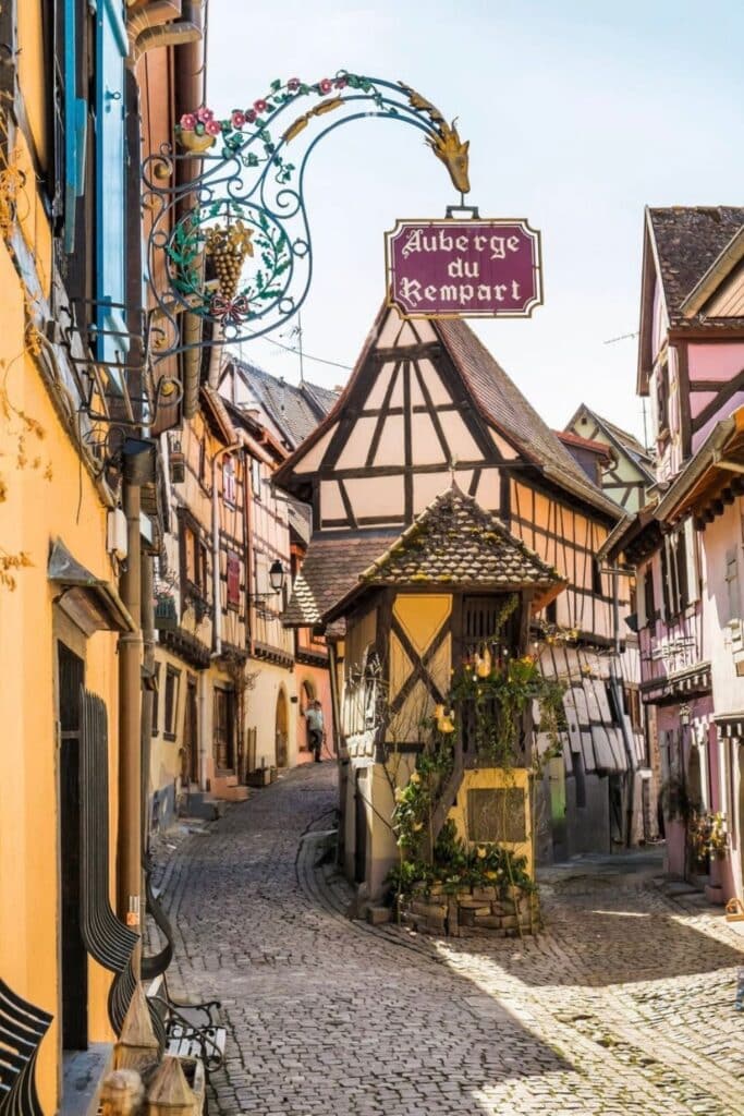 Charming cobblestone streets and colorful half-timbered houses in Eguisheim, one of the most picturesque places to visit in Alsace, known for its medieval beauty and wine heritage.