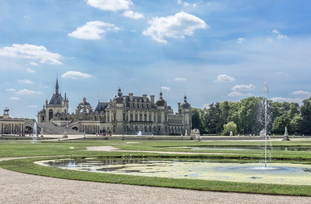 The stunning Château de Chantilly, with its elegant architecture, lush gardens, and serene fountains, is a perfect destination for day trips from Paris France.