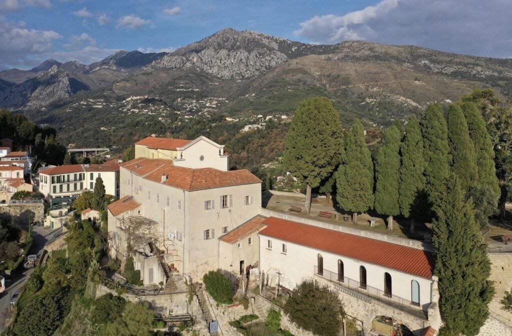 Perched on a hillside with stunning mountain views, the historic Monastère de l'Annonciade offers a peaceful retreat and is a must-visit for those looking for unique things to do in Menton France.
