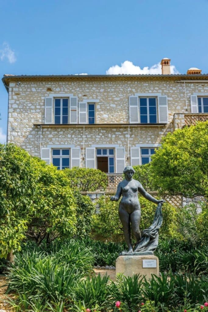 The serene gardens of the Musée Renoir in Cagnes-sur-Mer, just outside Nice, feature lush greenery and elegant sculptures surrounding the former home of the renowned painter—one of the best artistic and historical things to do in Nice.