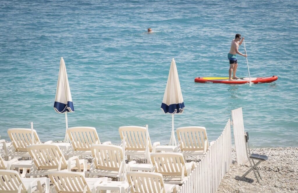 Enjoying a relaxing day on Nice’s pebble beaches or paddleboarding on the crystal-clear Mediterranean waters are some of the best things to do in Nice for a perfect mix of leisure and adventure.