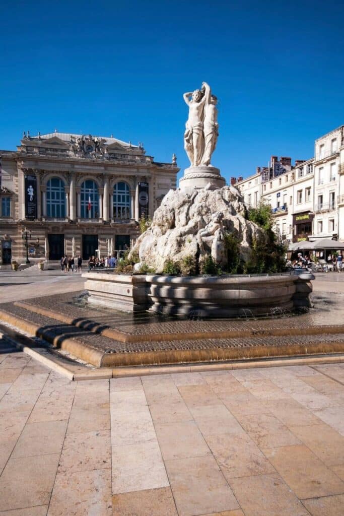 The Fontaine des Trois Grâces, a stunning fountain in Montpellier’s Place de la Comédie, is a must-see landmark and one of the top things to do in Montpellier.
