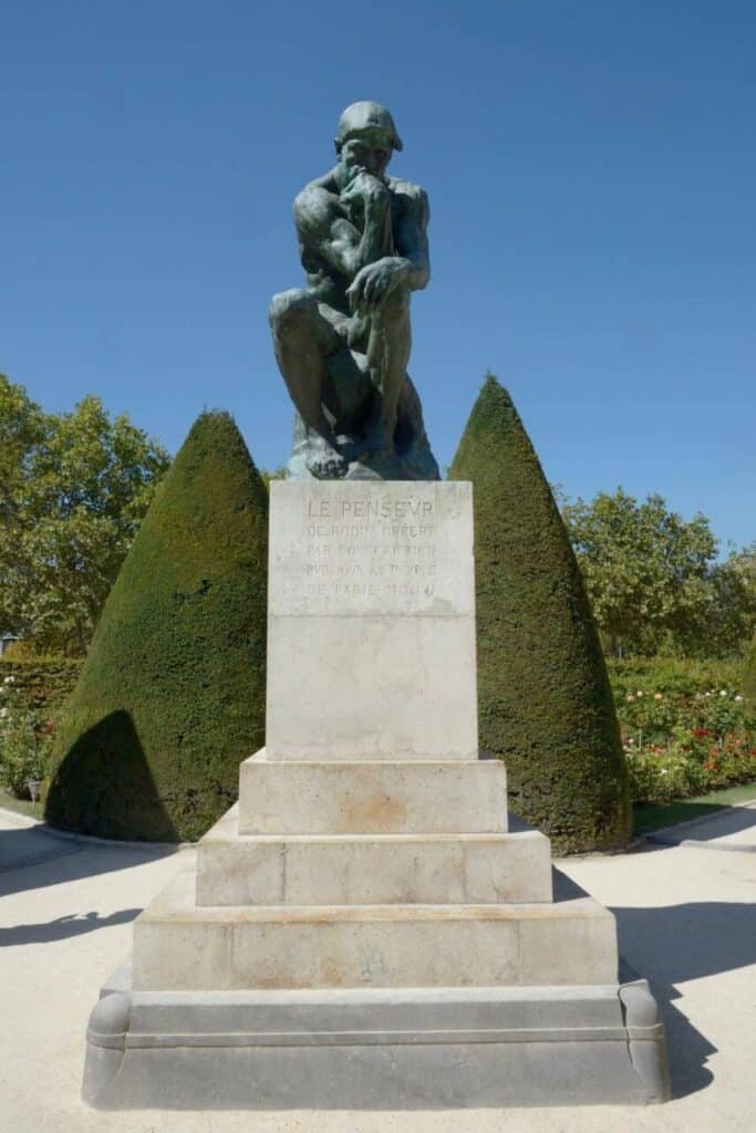 The famous bronze sculpture Le Penseur by Auguste Rodin, displayed in the gardens of the Rodin Museum—an inspiring stop for art lovers exploring where to stay in Paris near world-class museums and cultural sites.