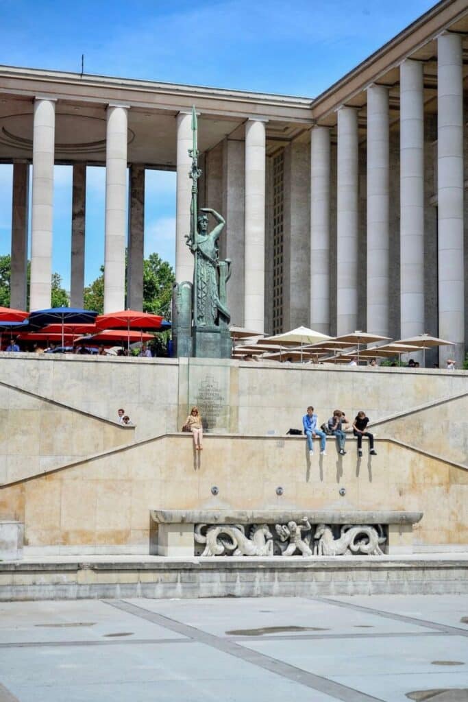 Visitors relaxing outside the Palais de Tokyo, one of Paris' top modern art museums—ideal for travelers exploring where to stay in Paris with a vibrant art and culture scene.