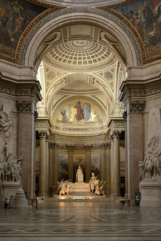 The grand interior of the Panthéon in Paris, featuring neoclassical architecture and historical sculptures—a must-see landmark for travelers choosing where to stay in Paris with easy access to the Latin Quarter’s cultural treasures.